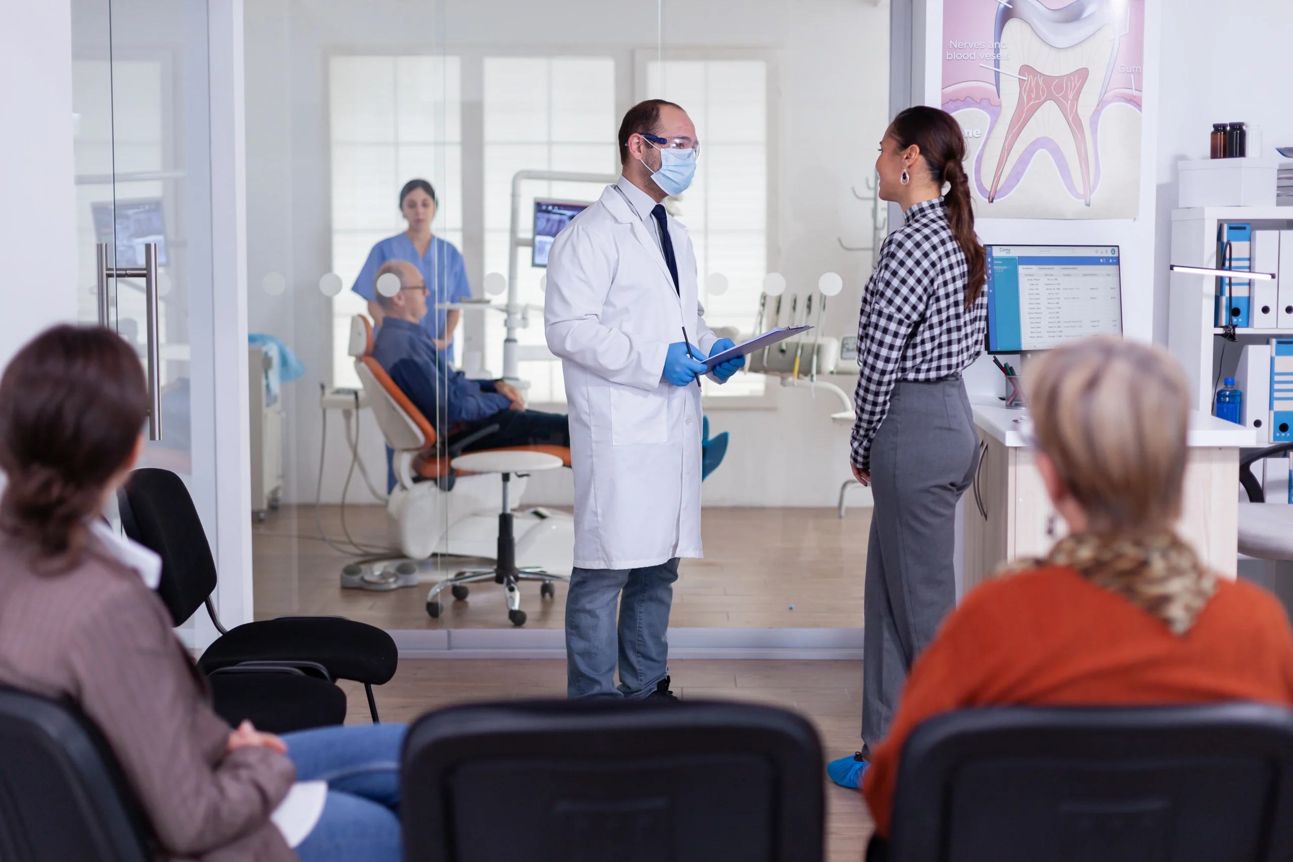 dentist explaining sleep dentistry to patient
