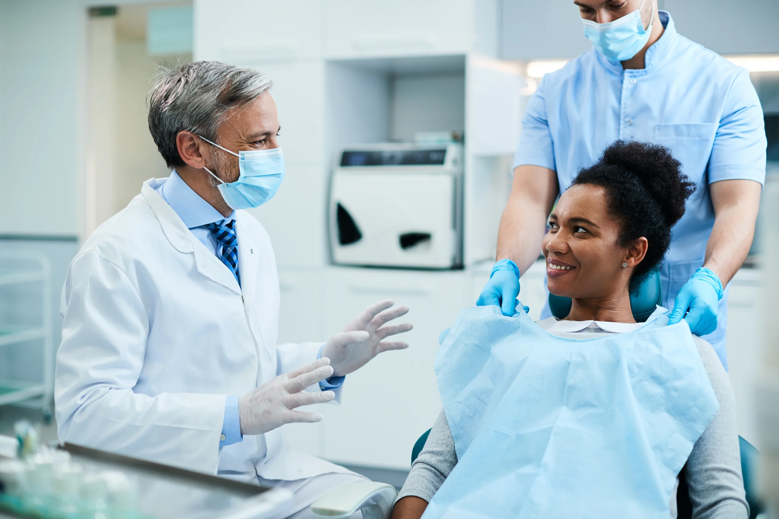 general dentistry dentist talking to a patient
